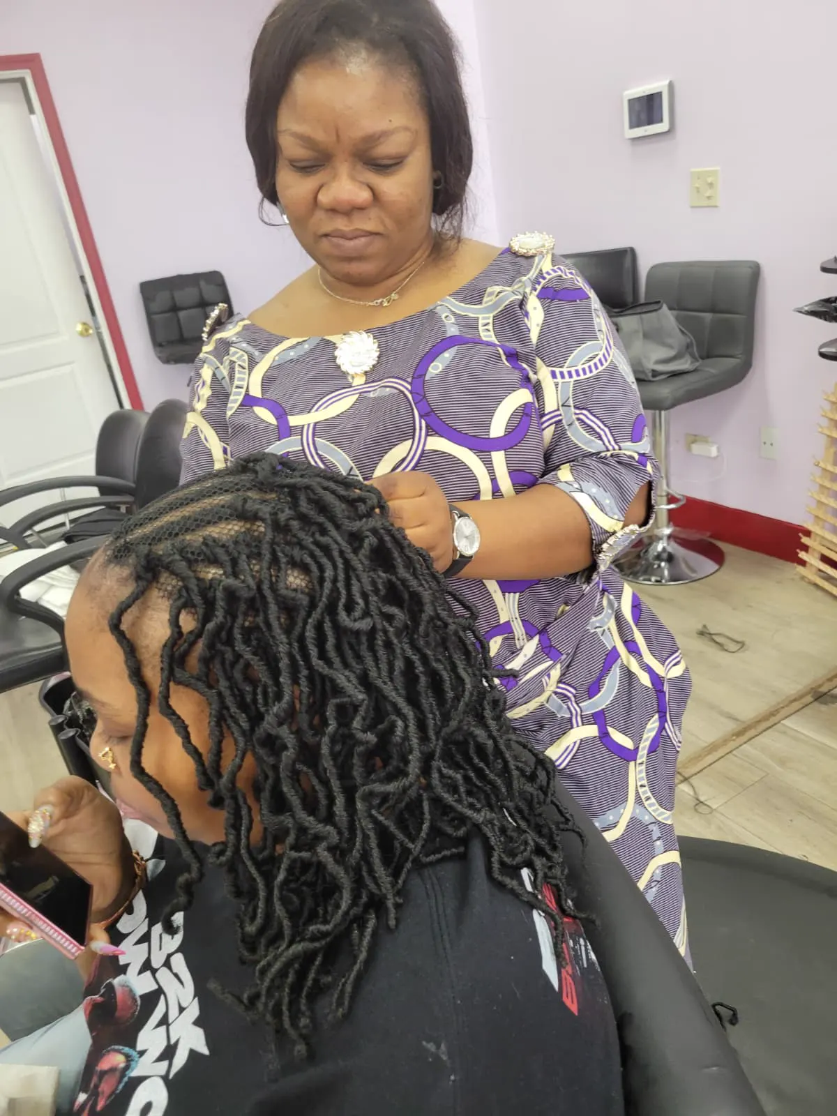 Braided style by Jacquie African Hair Braiding